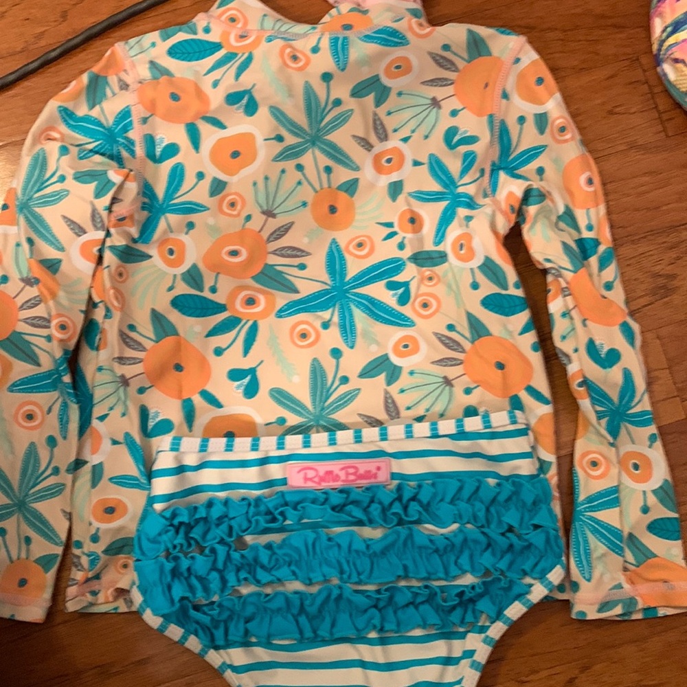 Ruffle Butts size 5 two piece swim suit.  Top is a full long sleeve shirt.